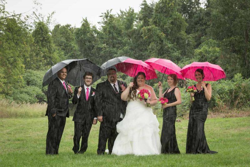 Bridal party group picture in the rain