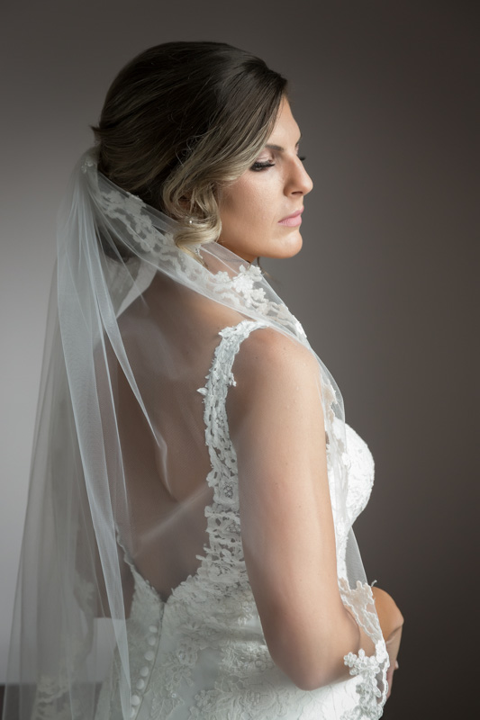 Bride backside shot holding veil