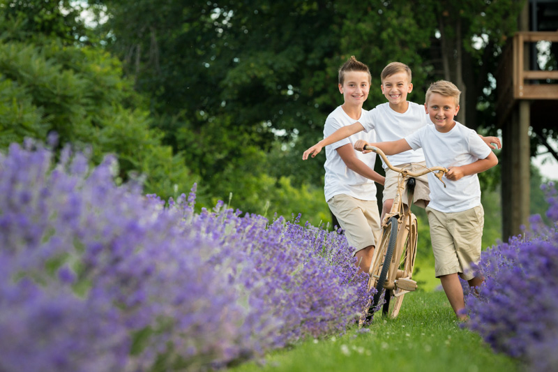 Three boys riding bike