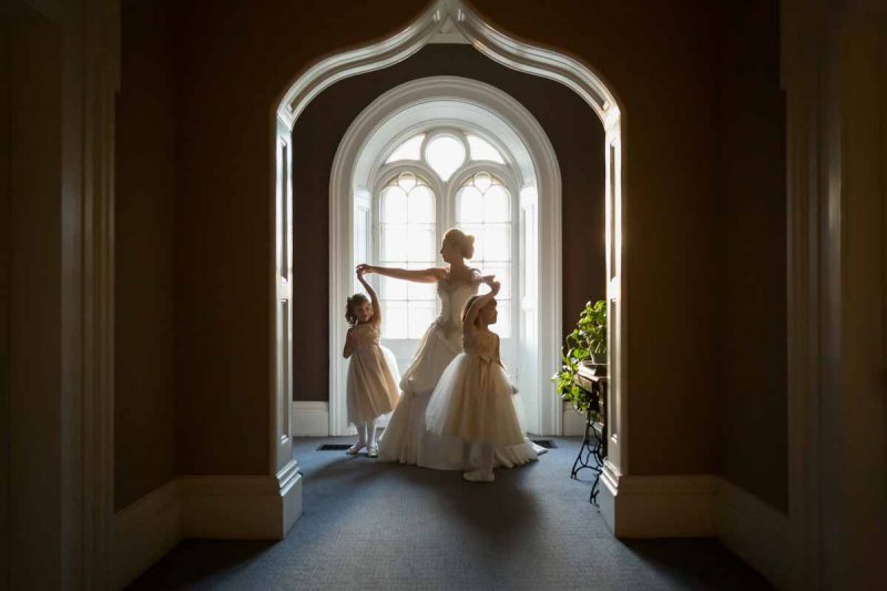 Bride and daughters dancing