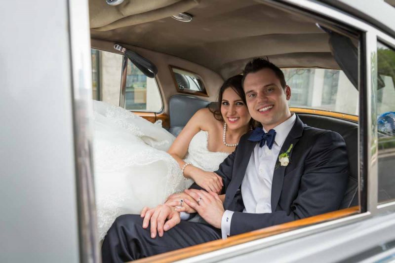 Bride and groom in limousine