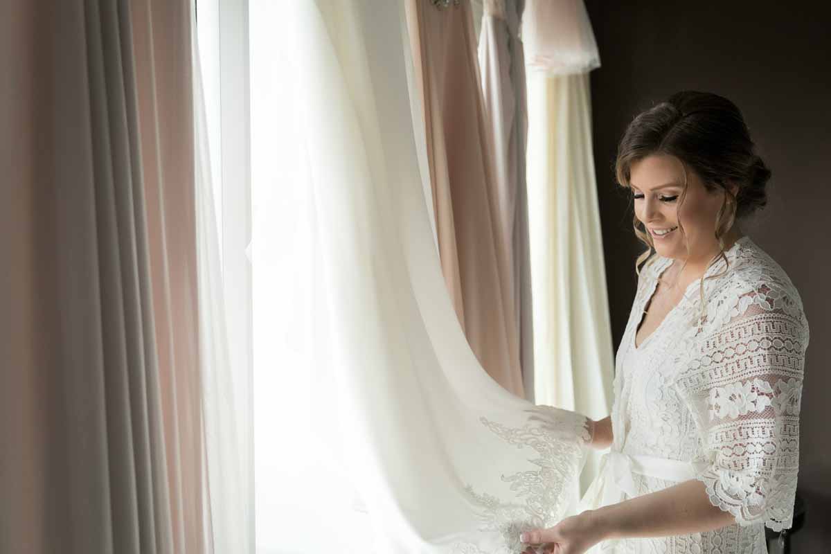 Bride overlooking at wedding dress