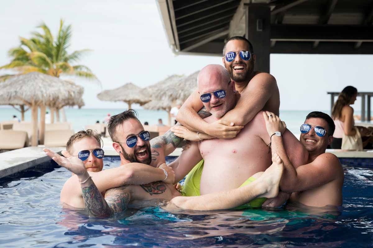 Groomsmen group picture in swimming pool