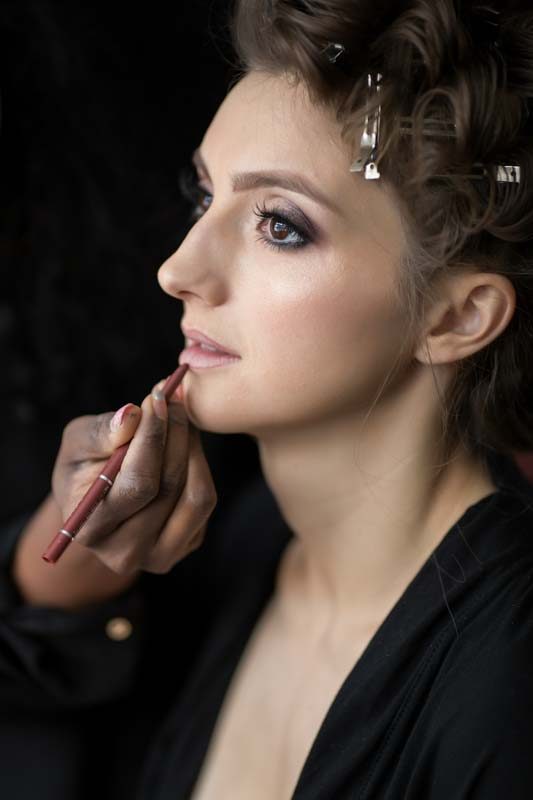 Bride getting makeup done
