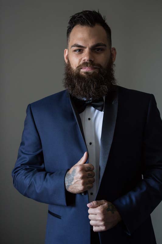 Groom posing during preparation