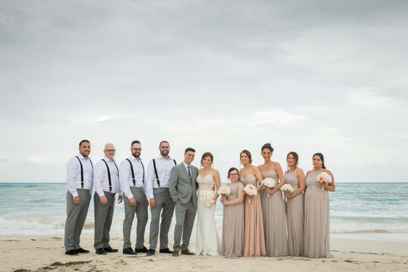 Group picture of wedding party on the beach